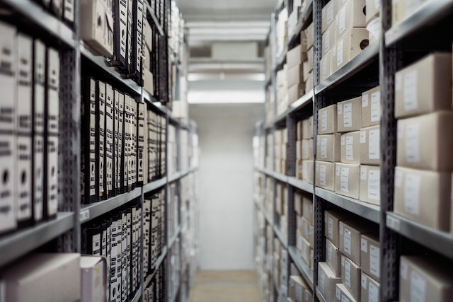 Two Massive Shelves Containing Lots Of Documents