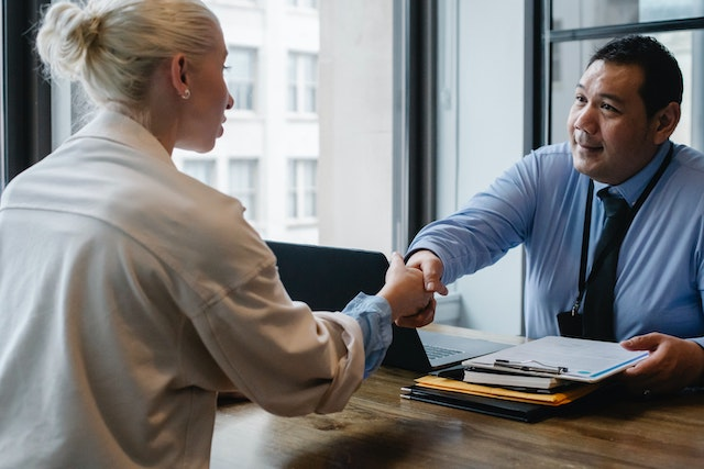 A man and woman having a handshake