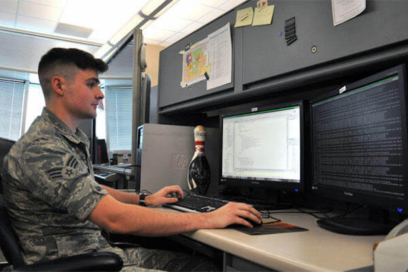 A soldier using a computer 