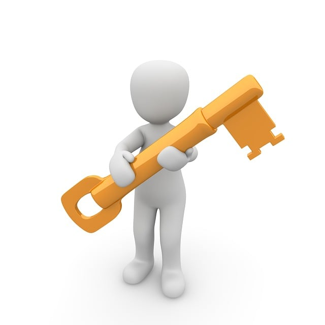 An animated figure holding a large golden key